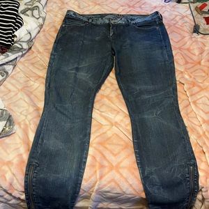 Express skinny jeans with zippers near bottom leg